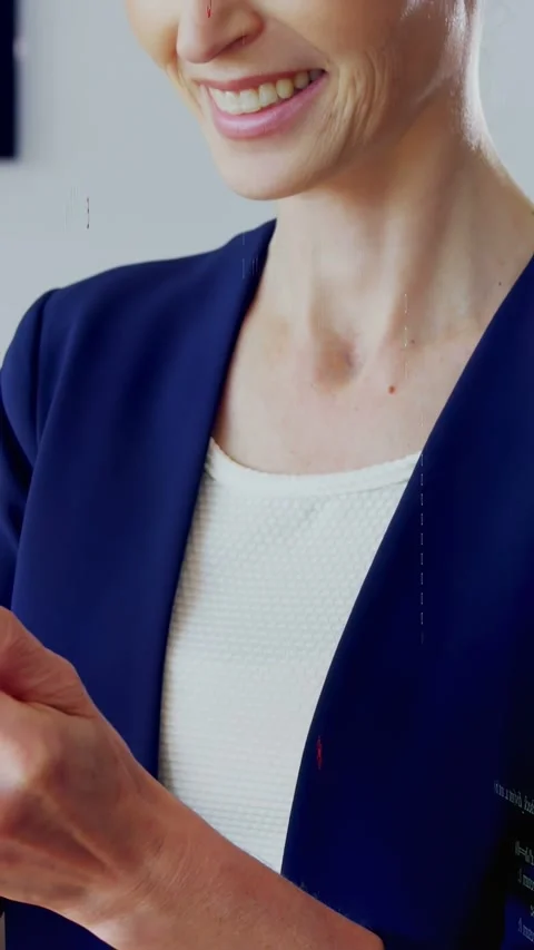 Vertical video: Woman in tech tapping phone, causing binary digits overlaying Stock Footage 333222066