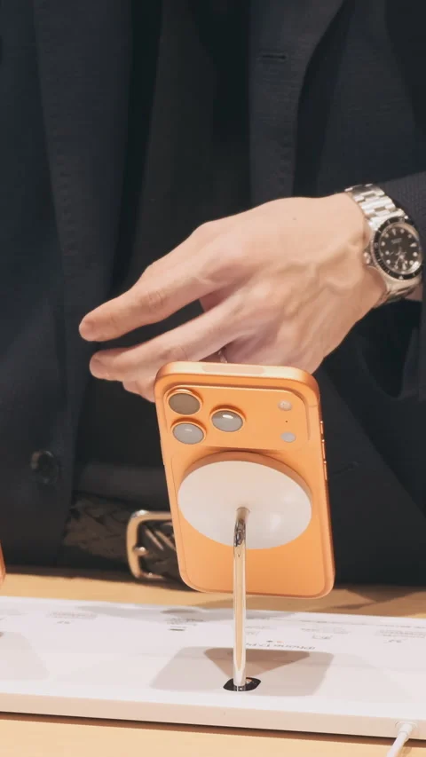 Vertical video: Woman testing new phone display units at Apple Store, close up.  Stock Footage 322514613