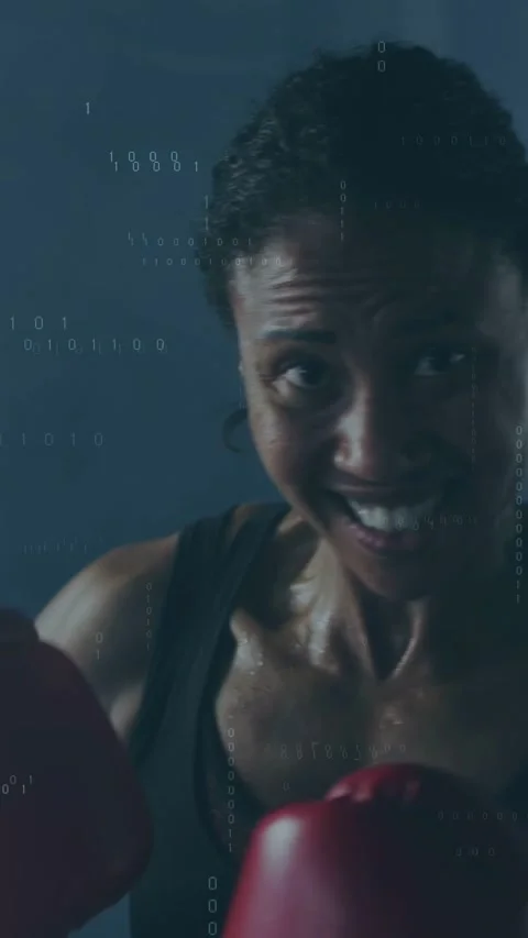 Vertical video: Woman throwing left jab, punching camera for training, red Stock Footage 333577564