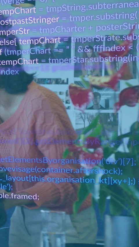 Vertical video: Woman using device in studio, code overlay rising and mapping Stock Footage 332317737