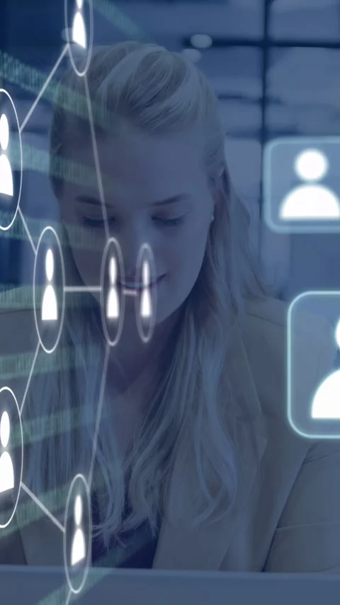 Vertical video: Woman using laptop seeing icons fading, causing tech network Stock Footage 334792599