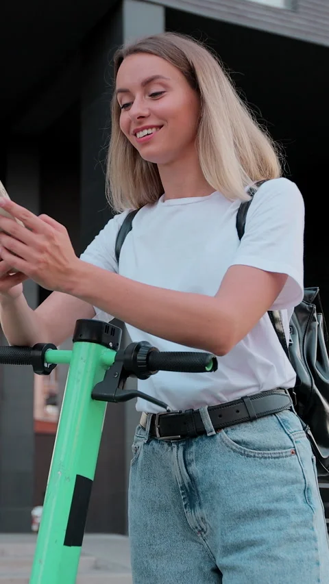 Vertical video. Woman is using smartphone after ride Stock-Footage 344431801