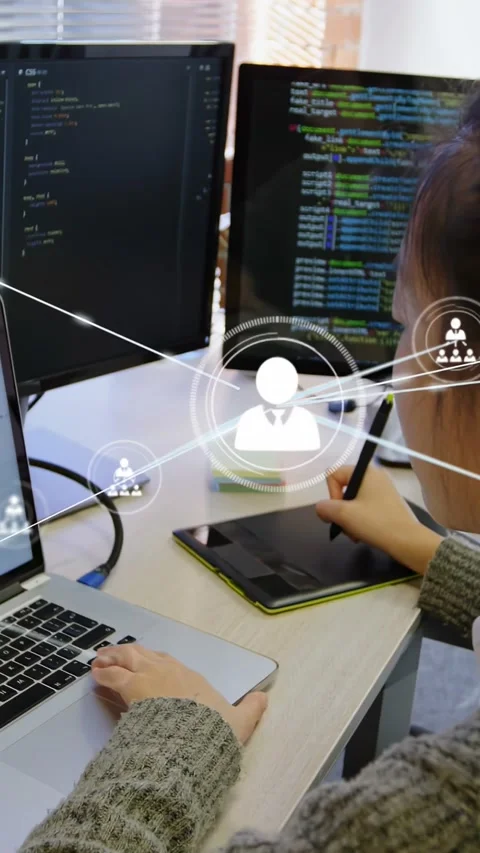 Vertical video: Woman using stylus and laptop, causing network overlay showing Stock Footage 334550098