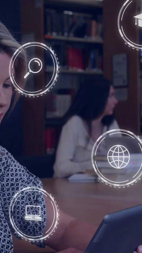 Vertical video: Woman using tablet in library tapping causing study icons over Stock Footage 330260134