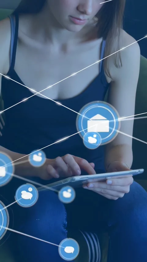 Vertical video: Woman using tablet, mail icon popping, forming tech chat Stock Footage 334390532