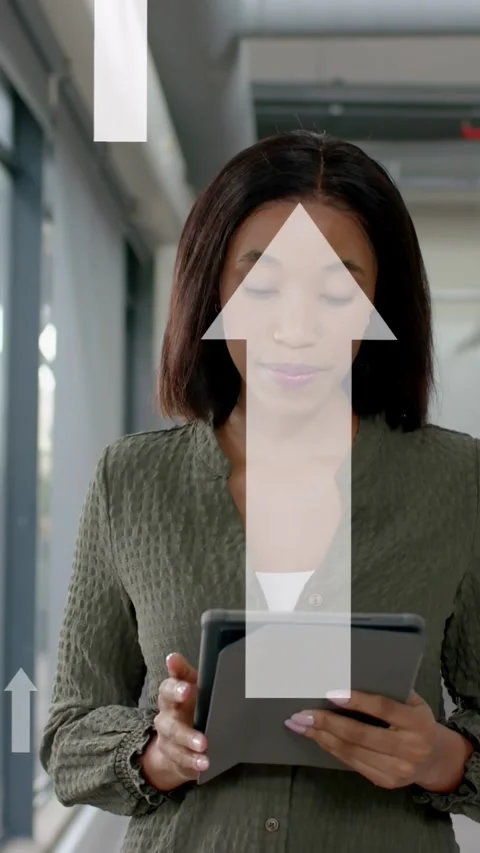 Vertical video: Woman using tablet in tech checking data tapping swiping Stock Footage 335355749