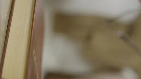 Vertical video. A womans hand takes reading glasses Stock Footage 316319340