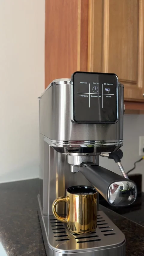 Vertical video of a woman's hand tapping the touchscreen of a coffee machine Stock Footage 342062233