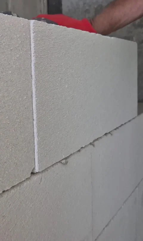 Vertical Video of Worker Building Ytong Wall in Budapest Stock Footage 333043103