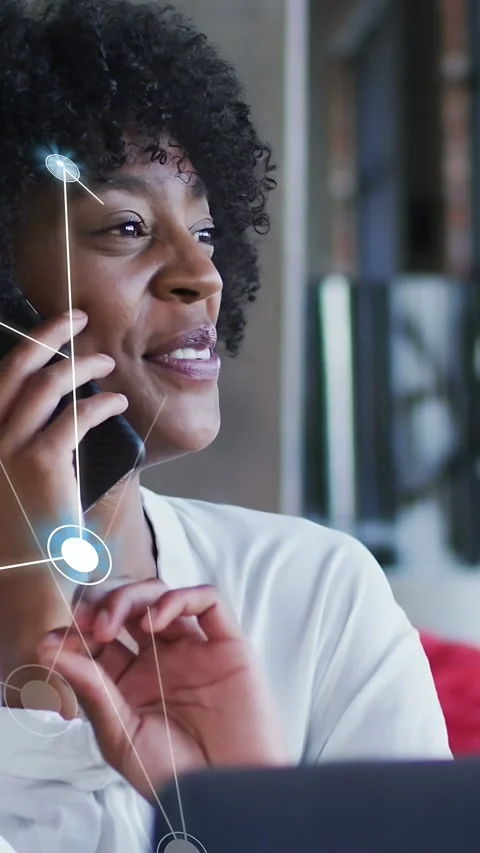 Vertical video: Worker on call, node overlay filling face while using speaker, Stock Footage 334917134