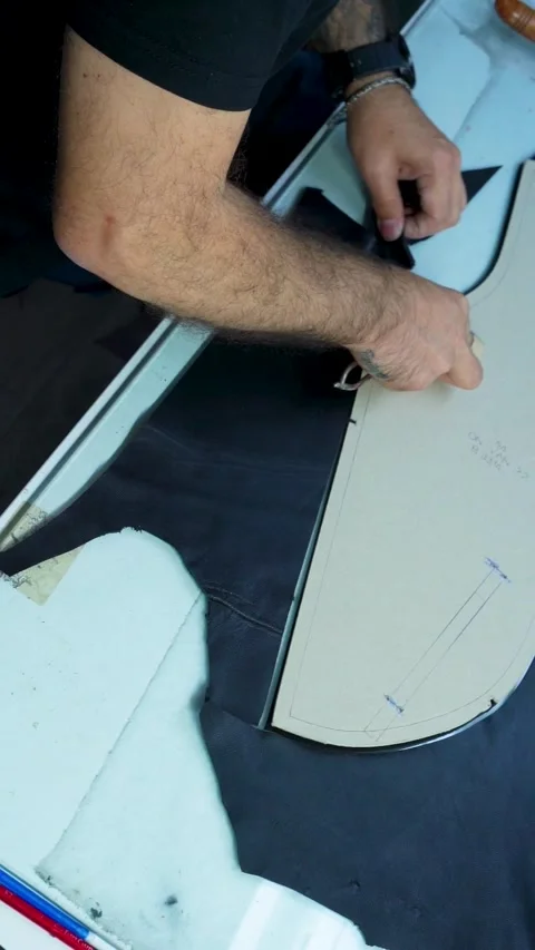 Vertical Video of Worker Cutting Black Leather in Factory, Izmir - 4 SEP 2025 Stock Footage 322057612