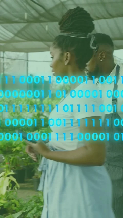 Vertical video: Worker holding phone pointing and making blue binary code Stock Footage 333542081