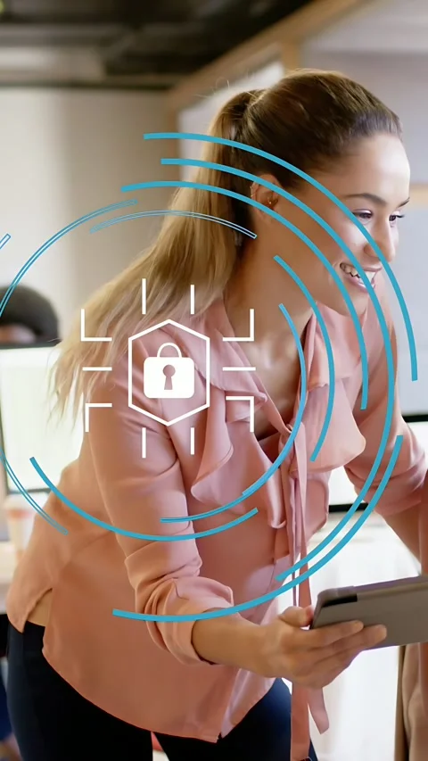 Vertical video: Worker leaning forward, tapping tablet, making lock icon spin, Stock Footage 333289734