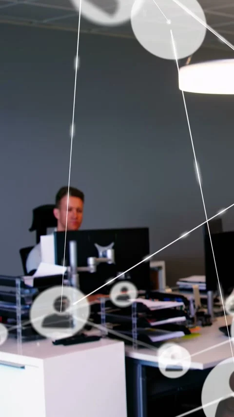 Vertical video: Worker sorting docs, icons popping right, covering screens to Stock Footage 333079690