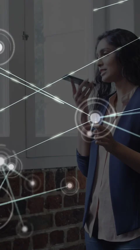 Vertical video: Worker speaking into phone in loft, activating HUD, forming node 스톡 동영상 330332753