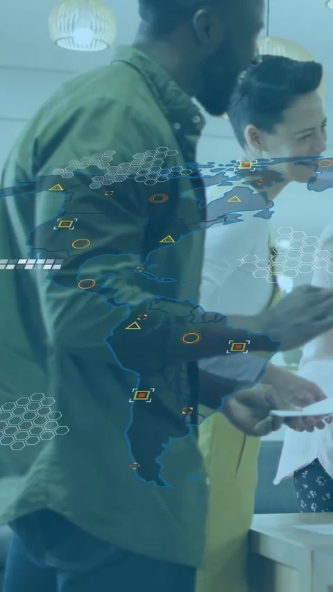 Vertical video: Worker tapping device in kitchen team gesturing map overlay Stock Footage 332687433
