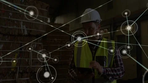 Vertical video: Worker tapping tablet and expanding node network across pallets Stock-Footage 332566078