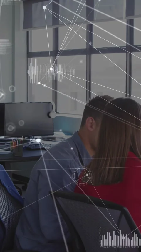 Vertical video: Worker turning after coworker cue to read monitor, tech node Video stock 330189487