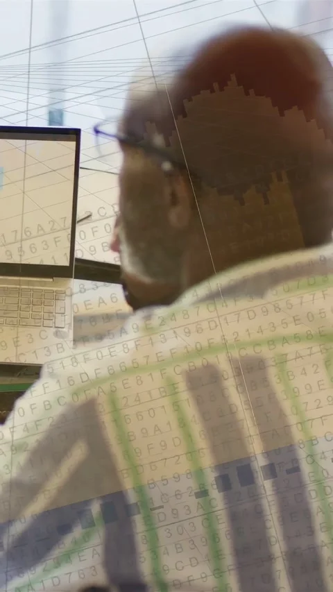 Vertical video: Worker turning to laptop, code overlay appearing while studying Stock Footage 332507111