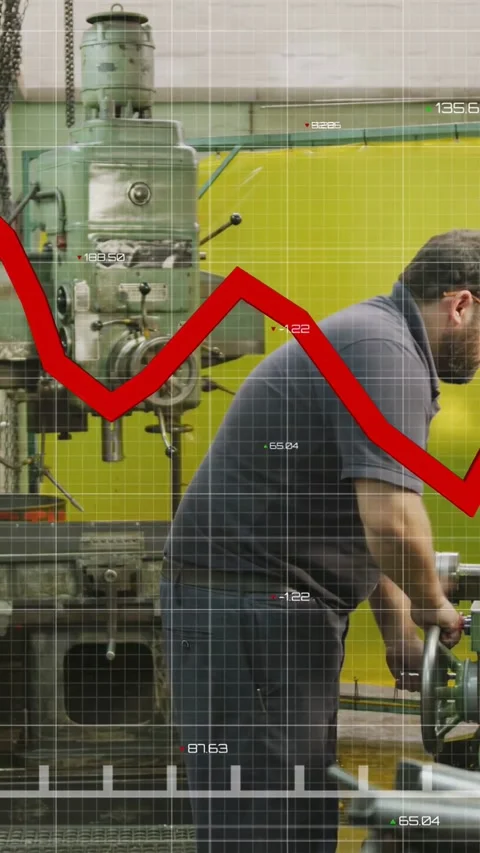 Vertical video: Worker turning wheel in machine shop causing red graph sweeping Stock Footage 334377504