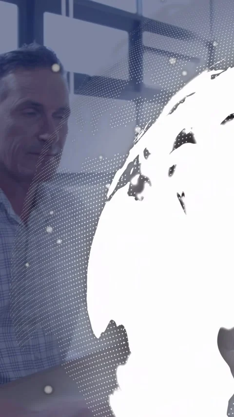 Vertical video: Worker using mouse, globe appearing from right over monitor Stock Footage 340133246