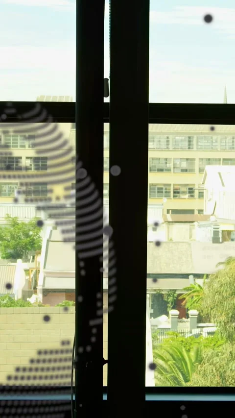 Vertical video: Worker walking past window taking call, pausing while tech Stock Footage 333005992