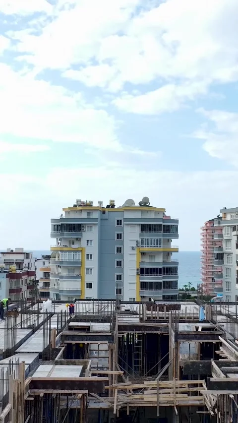 Vertical Video: Workers and engineers are preparing a new construction floor Stock Footage 297638513