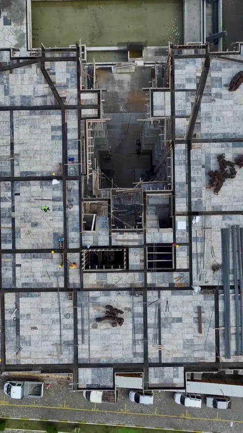 Vertical Video: Workers and engineers at a busy construction site, preparing Stock Footage 297638559