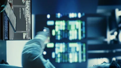 Vertical video Workers coding in data center Stock Footage 250361511