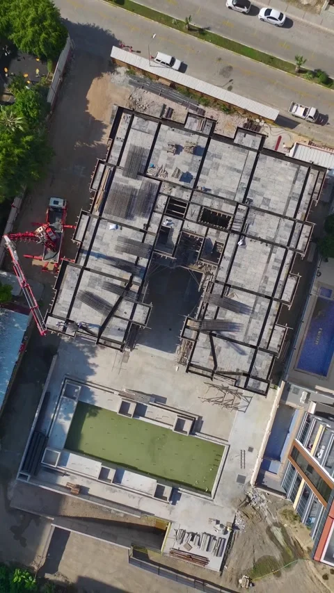 Vertical Video: Workers on a Construction Site Handling Metal, Installing Stock Footage 297749321