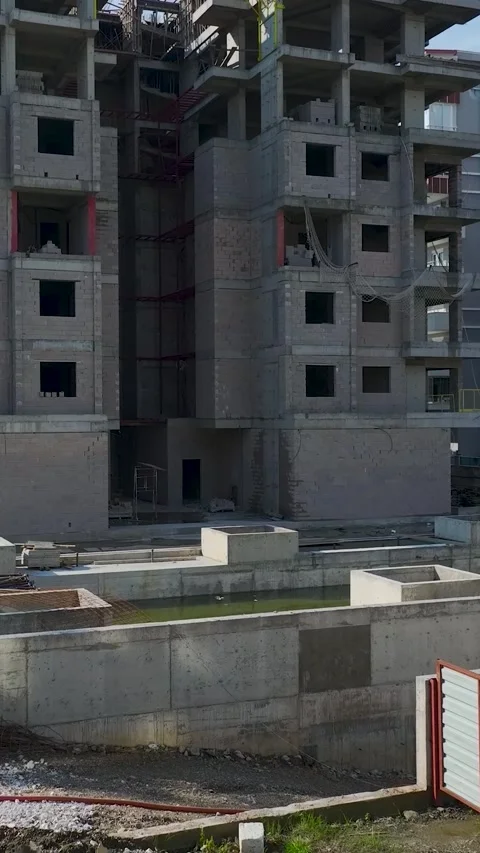 Vertical Video Workers Handling Materials on Construction Site Stock Footage 341834448