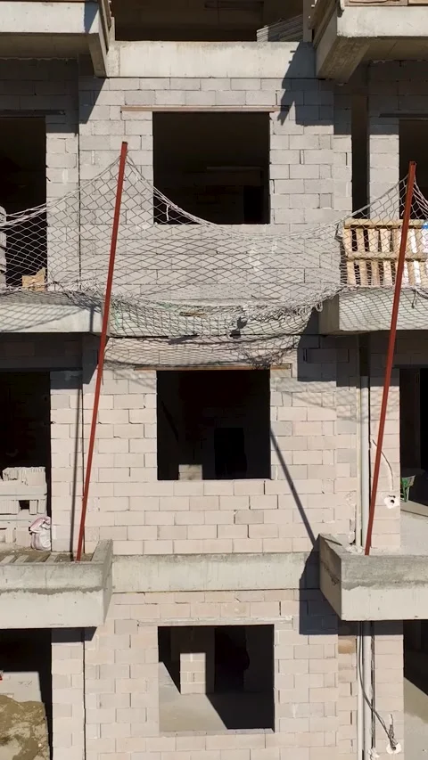Vertical Video Workers Installing Structural Elements from Above Stock Footage 341835197
