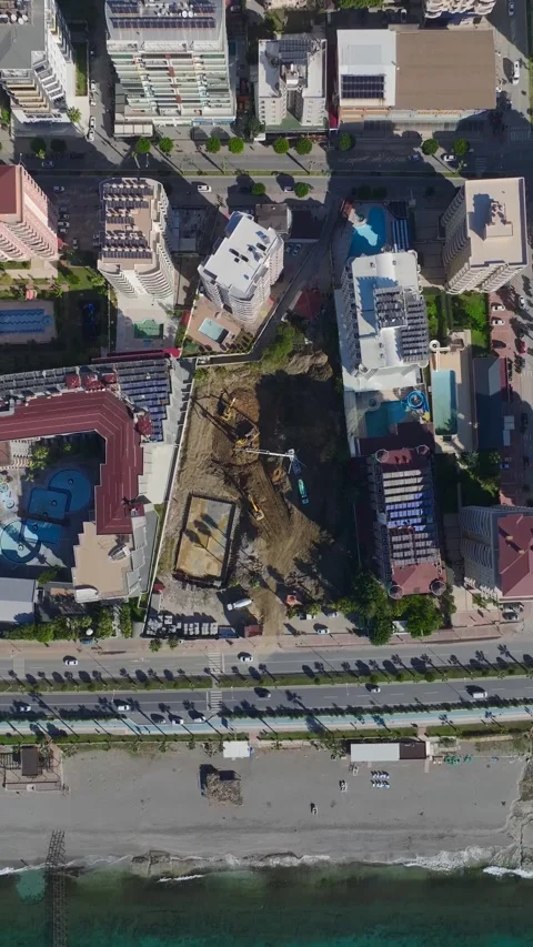 Vertical Video: Workers Installing Structures and Operating Tools on a Busy Stock Footage 342579075
