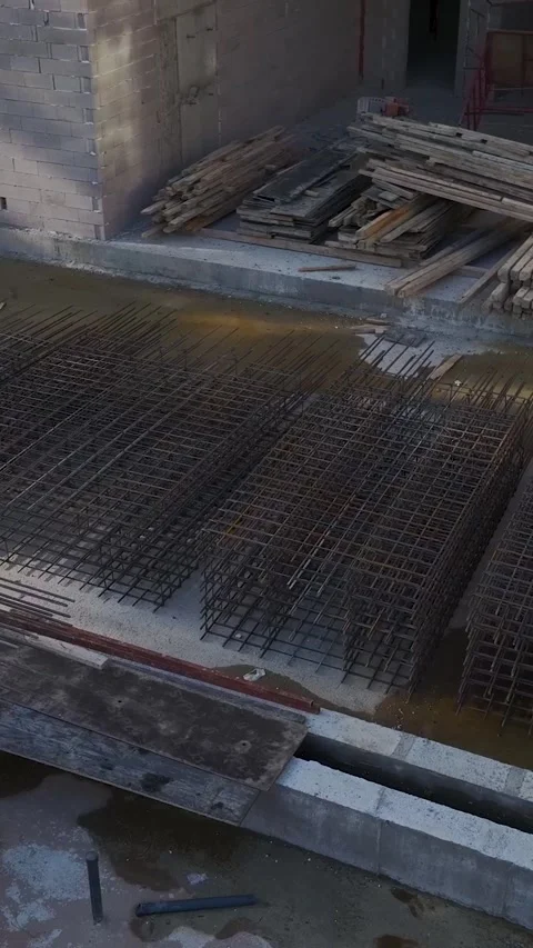 Vertical Video Workers Moving Across Concrete Frame at Height Stock Footage 342120126