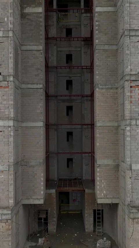 Vertical Video of Workers on Scaffolding Securing Wall Elements Stock Footage 342414827