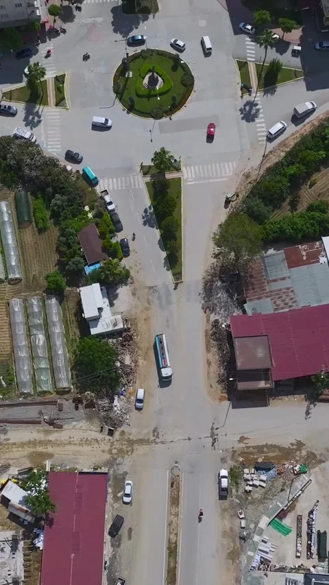 Vertical Video: Workers in a small coastal town handle construction tasks Vidéo 297677357
