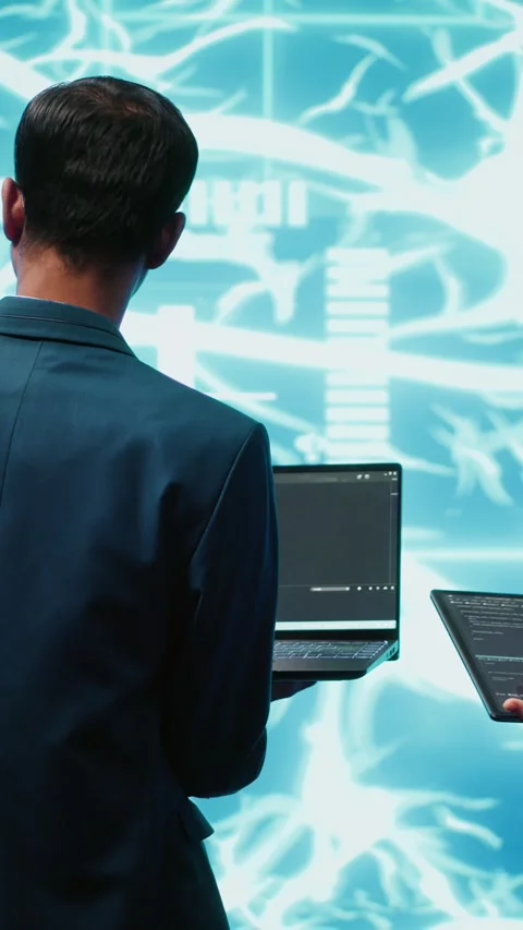 Vertical video Workers using artificial intelligence deep learning to look at Stock Footage 278375756