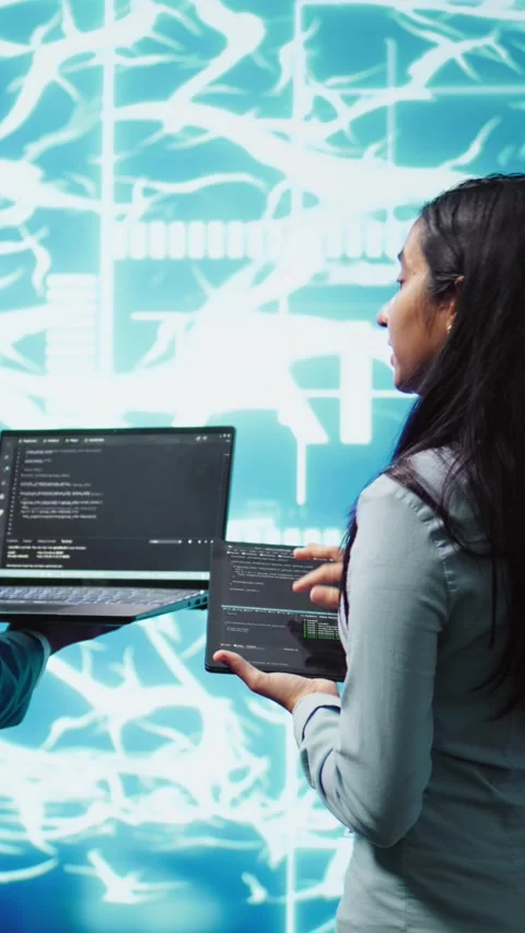 Vertical video Workers using artificial intelligence deep learning to look at Stock Footage 278553724