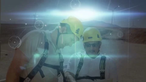 Vertical video: Workers in yellow hard hats and harness inspecting tablet at Stock Footage 333965709