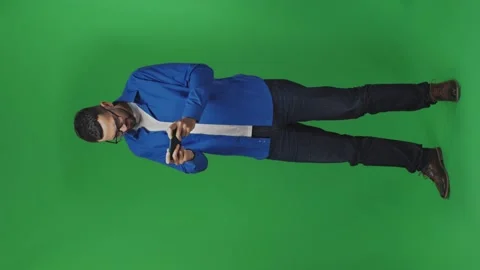 Vertical video of worried funny addicted young man enthusiastically playing Stock Footage 172256653