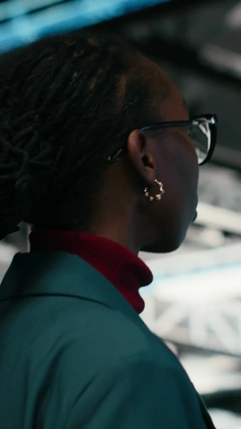 Vertical video Writing code, tablet application and programmer in data center Stock Footage 329943809