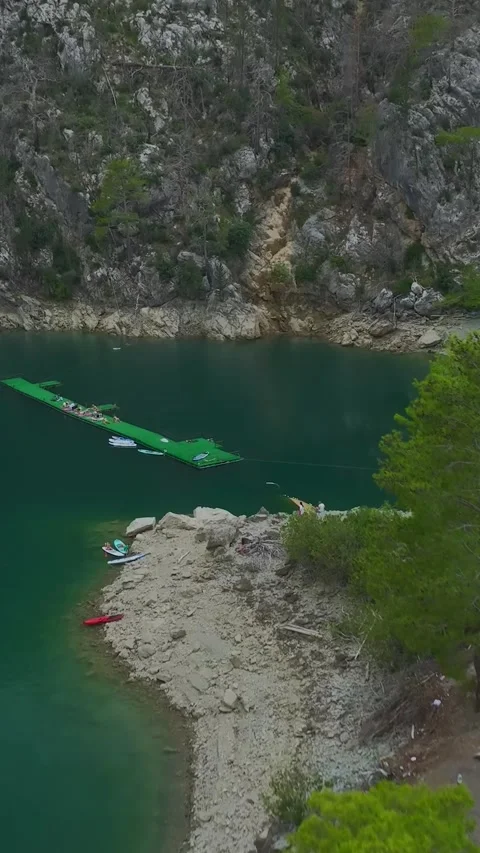 Vertical Video: Yoga Flow in a Magical Canyon Surrounded by Towering Cliffs and Stock Footage 297787366