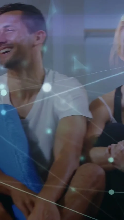 Vertical video: Yoga group sitting floor camera panning overlay linking mats Stock Footage 334544805