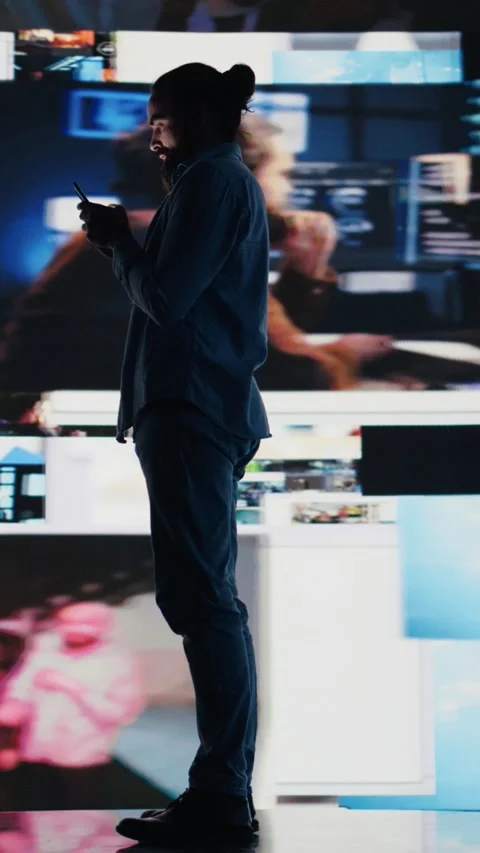 Vertical Video Young addicted guy obsessing over social media presence at all Video stock 310759433