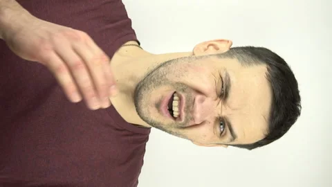 Vertical video. Young attractive guy gets a slap in the face from his girlfriend Stock Footage 150462942