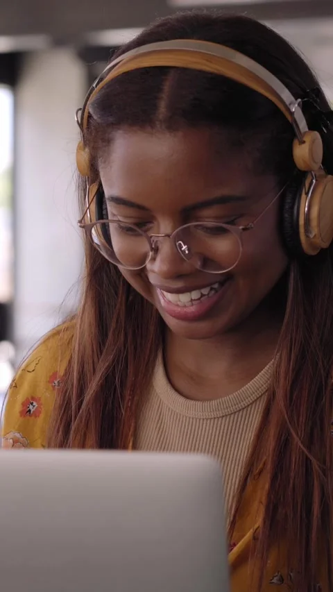 Vertical video Young black African college girl studying online on her laptop Stock Footage 236574521