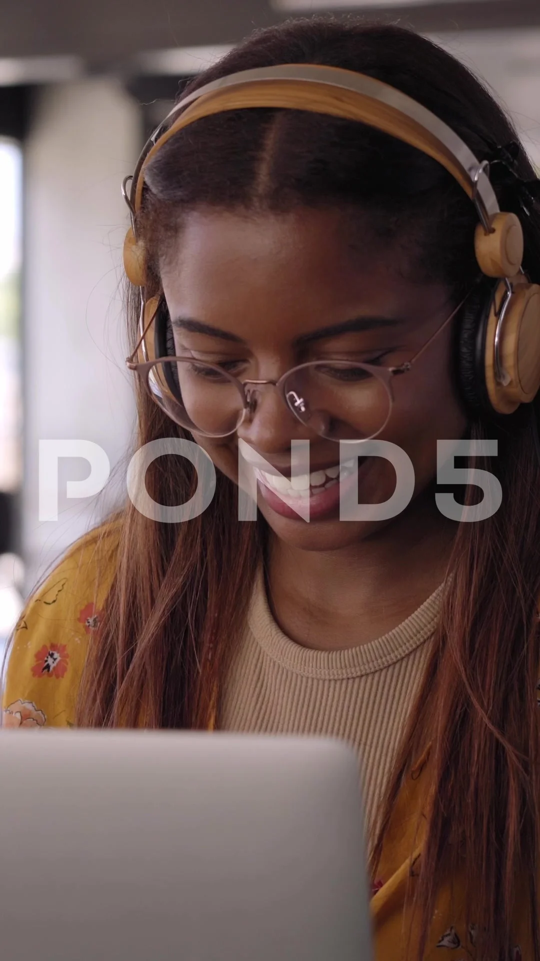 Vertical video Young black African college girl studying online on her  laptop