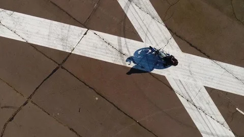 Vertical video. A young couple with a guy and a girl sitting on a motorcycle Video stock 267566384