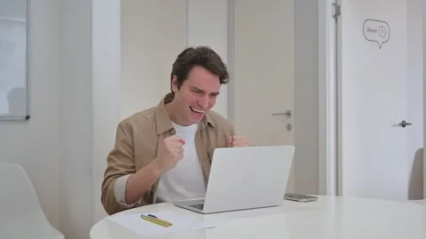 Vertical Video, Young Creative Man Celebrating Success on Laptop Stock Footage 312913974