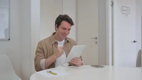 Vertical Video, Young Creative Man Reading Documents at Work Stock Footage 312914074